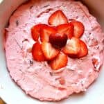 a strawberry fluff salad that it pink and has Jell-O, cool whip and strawberries in it