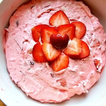 a strawberry fluff salad that it pink and has Jell-O, cool whip and strawberries in it