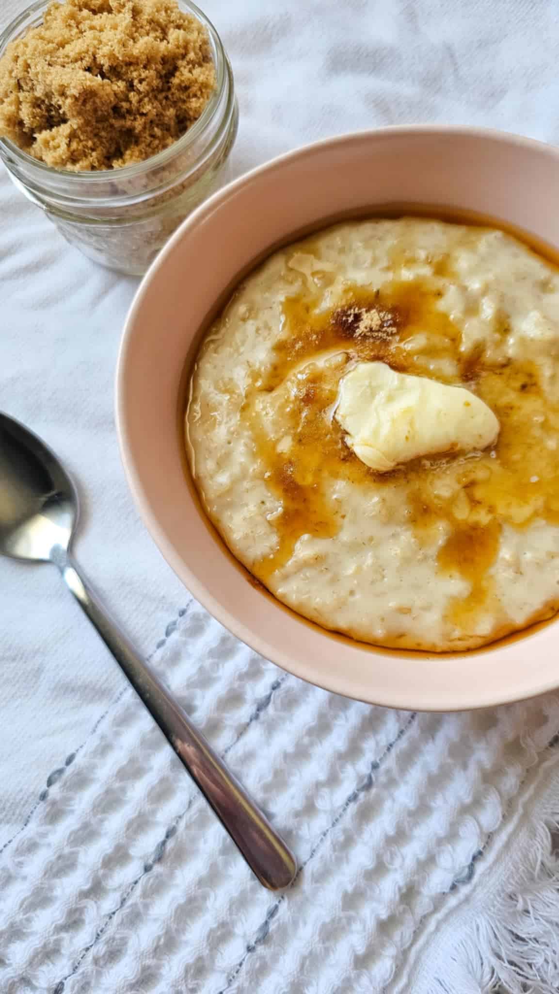 creamy oatmeal with melted butter on top and brown sugar