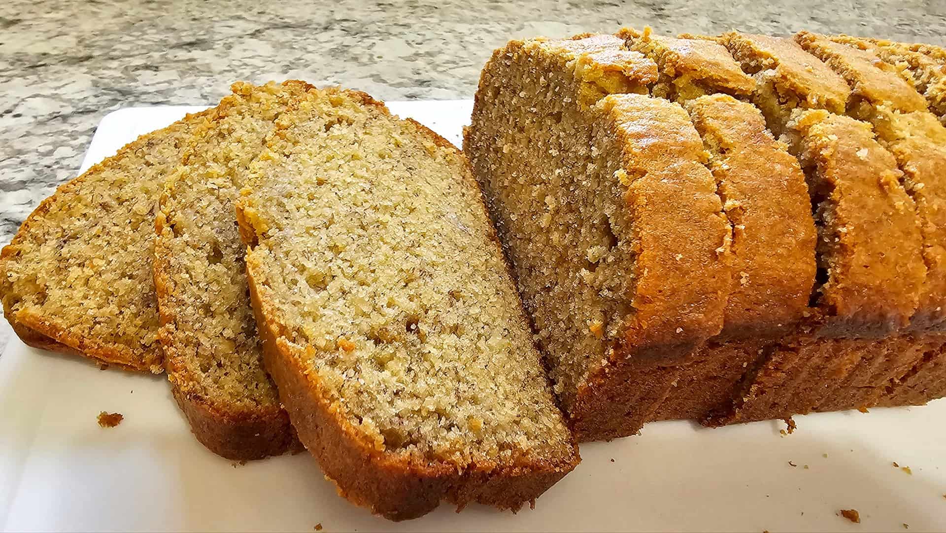 old fashioned banana bread sliced thick on a pate