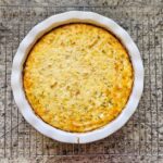 chicken and rice casserole in a pie dish cooling on a cooling rack