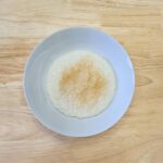creamy rice cereal in a bowl with a wooden background