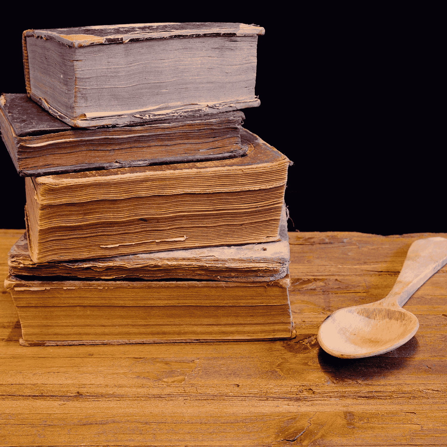 old cookbooks in a pile