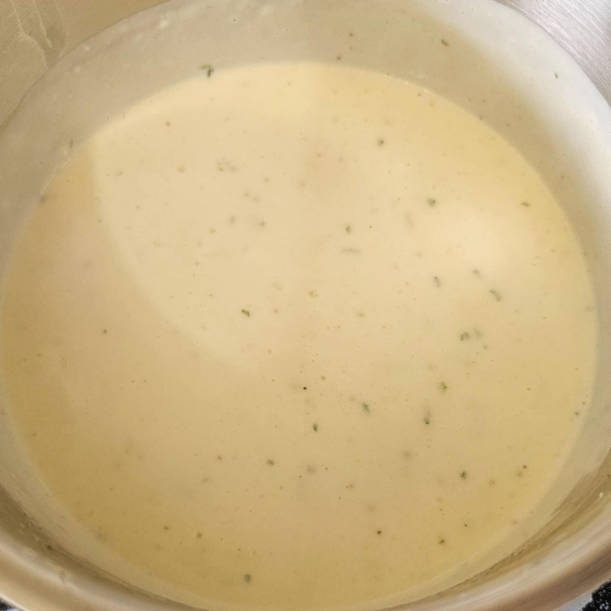 spices added to the roux in a stainless steel pot