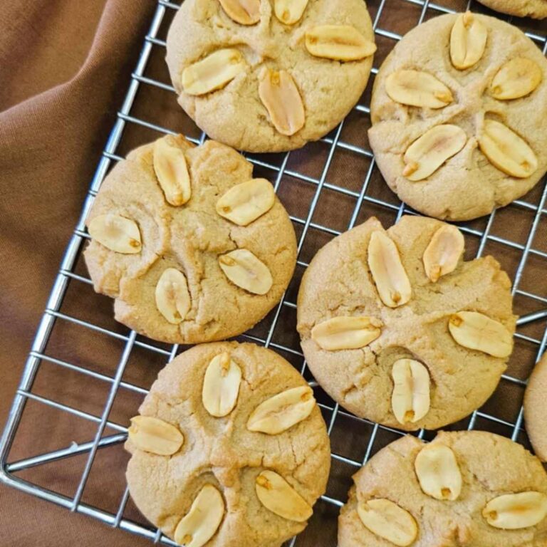 peanut butter cookies on a wire rack cooling
