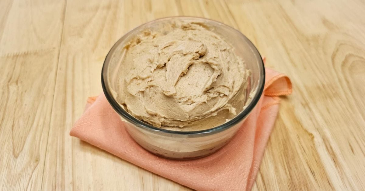 honey butter in a glass bowl on a wooden counter top