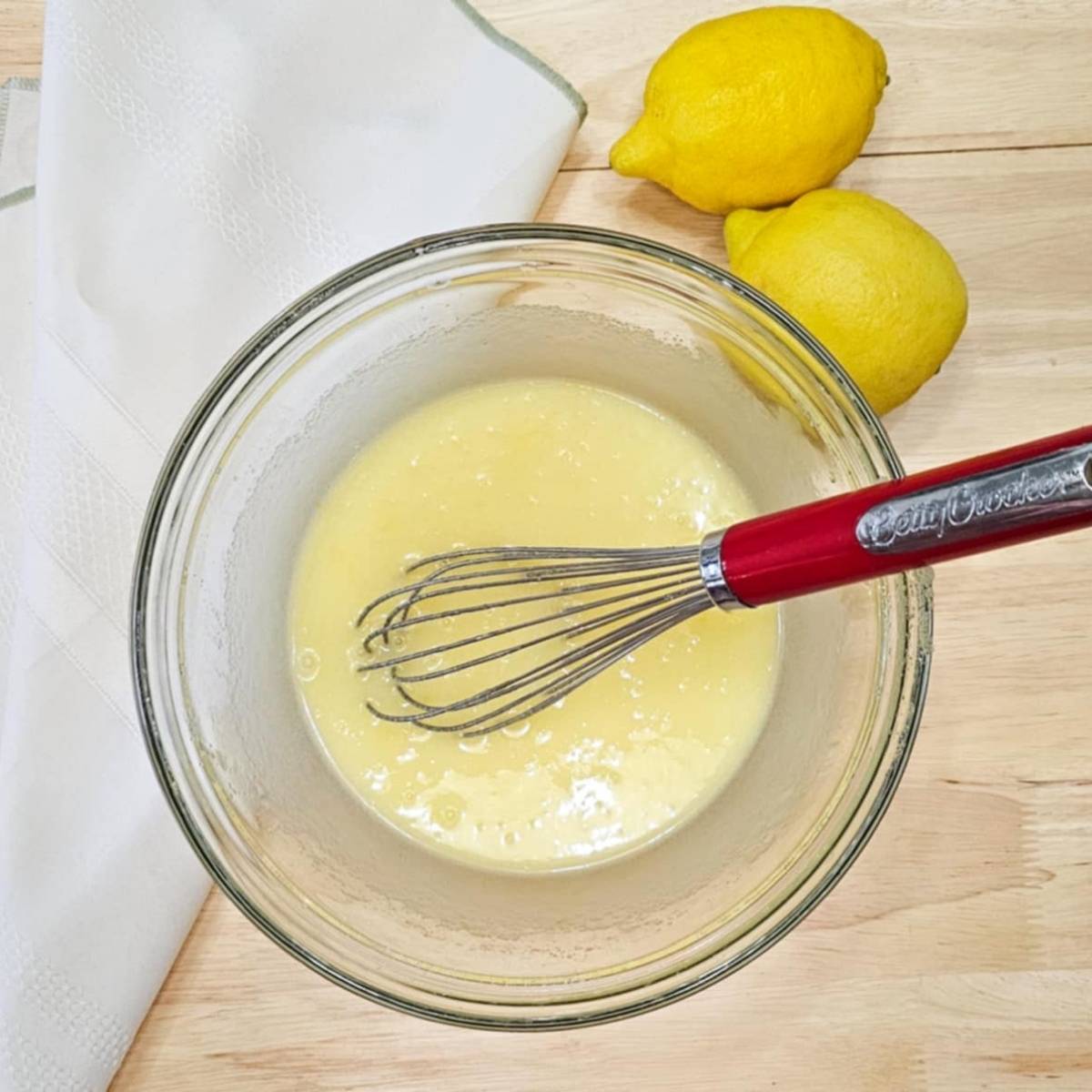 lemon loaf batter in a glass bowl