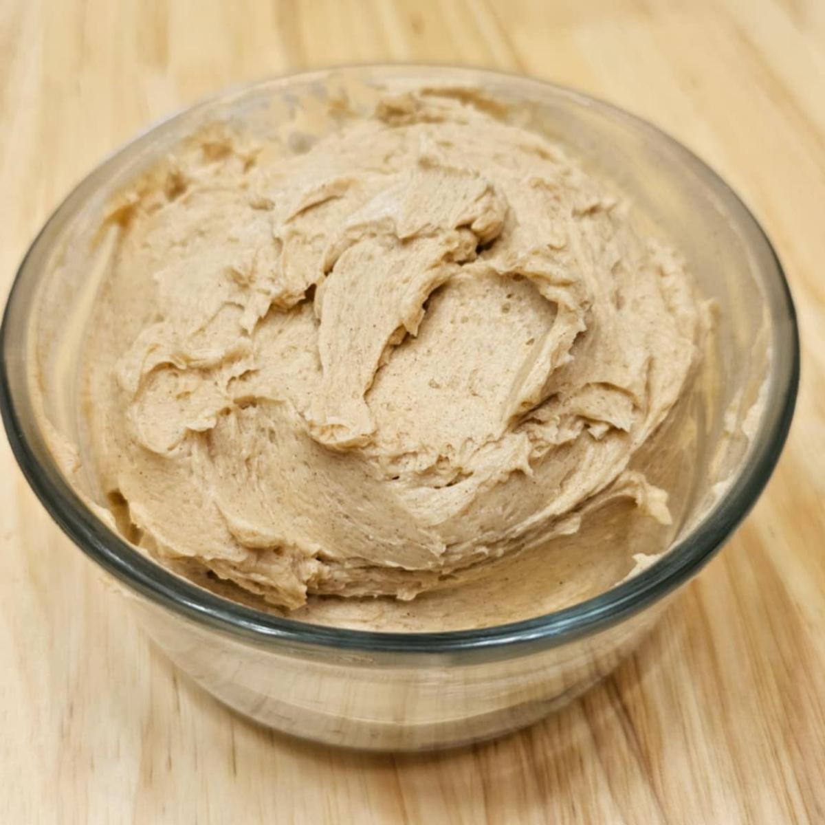 honey butter in a glass bowl on a wooden counter