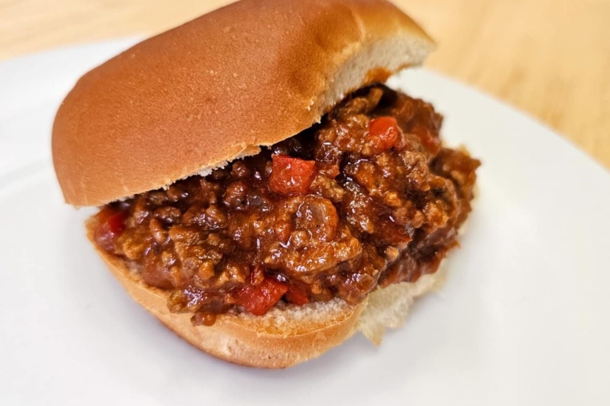 Old Fashioned Heinz Ketchup Sloppy Joe Recipe on a bun on a white plate