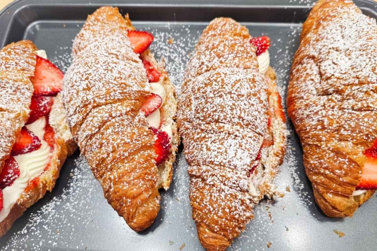 strawberries and cream croissants on a serving tray