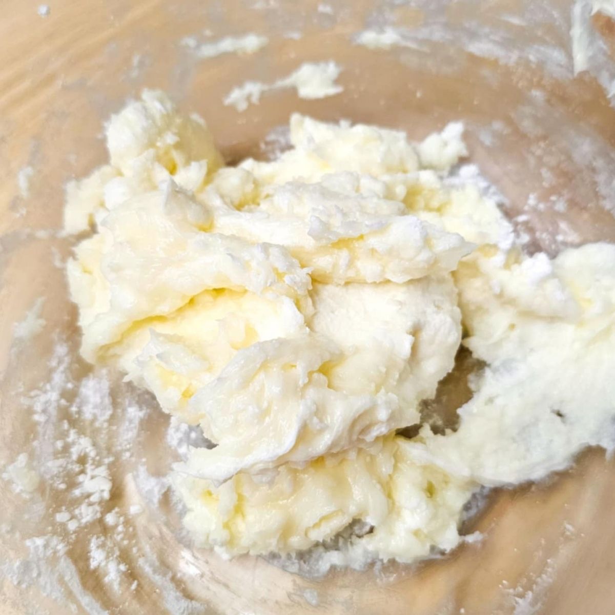 cream cheese whip cream in a glass bowl