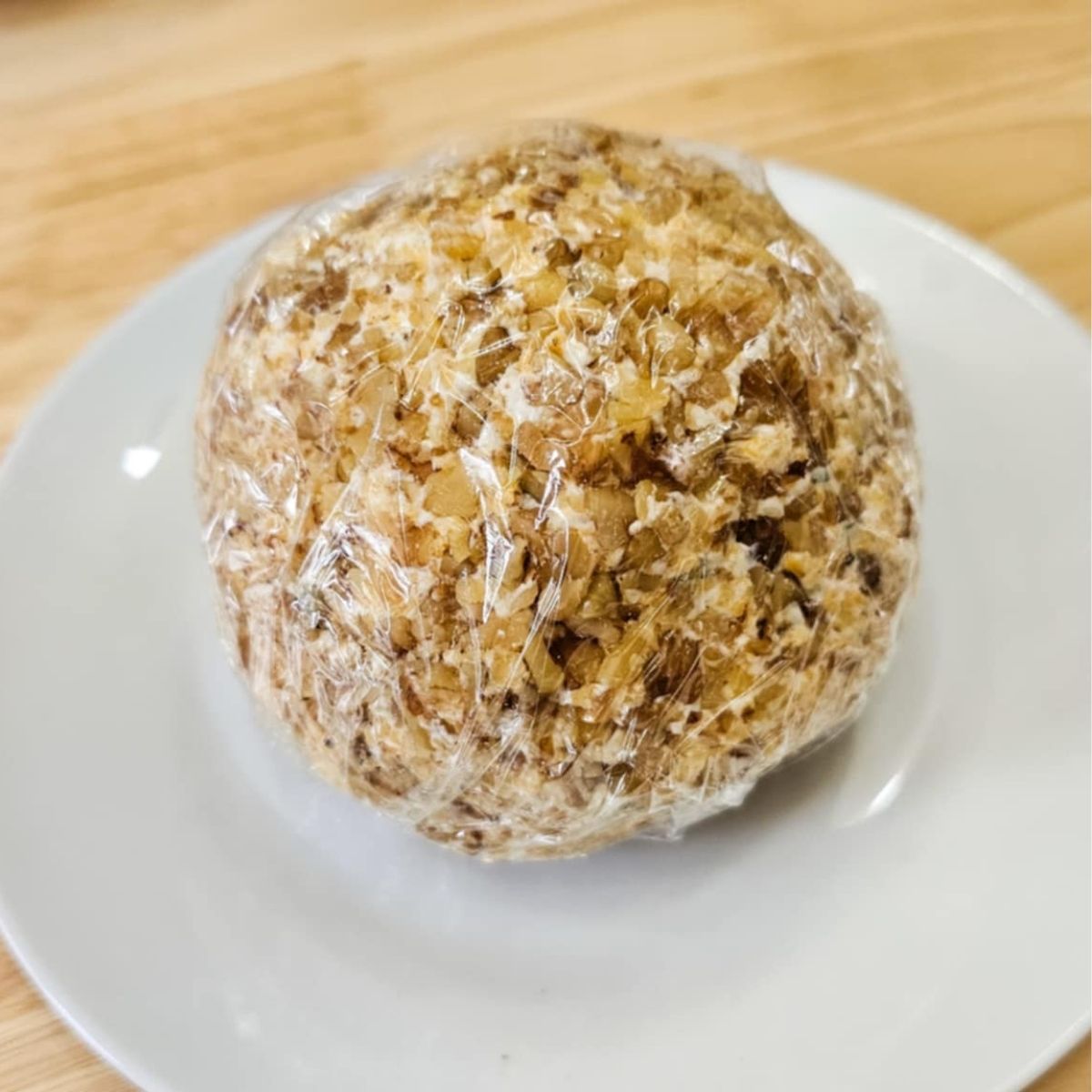 cheese ball wrapped in cling wrap