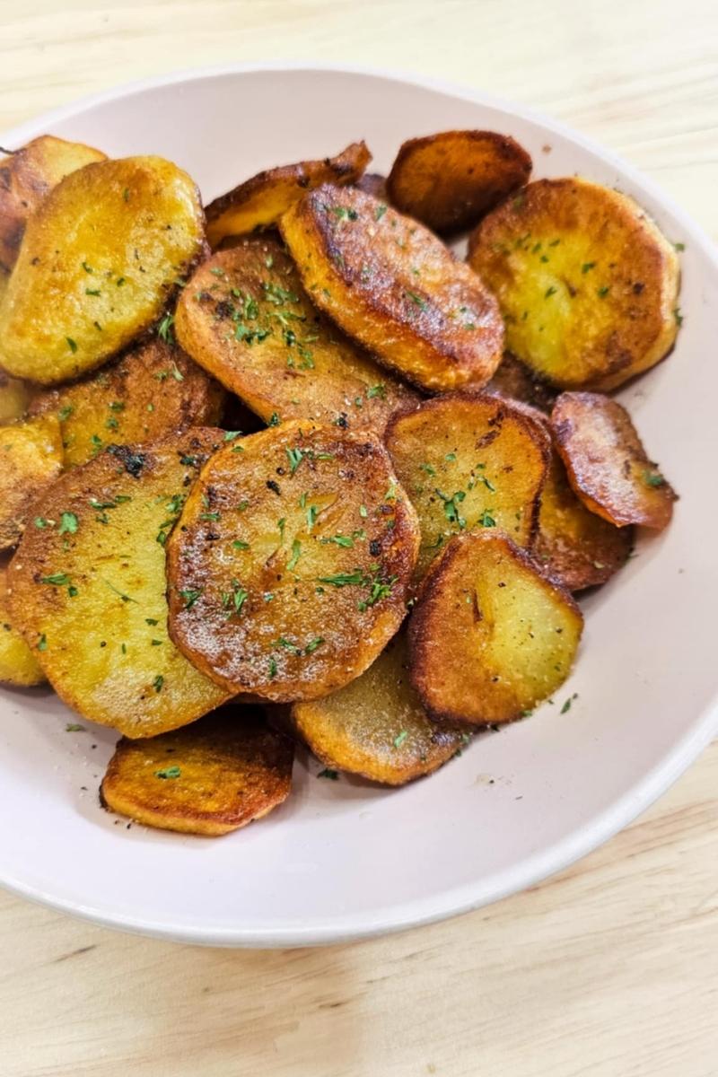 pan fried potatoes in a pink bowl