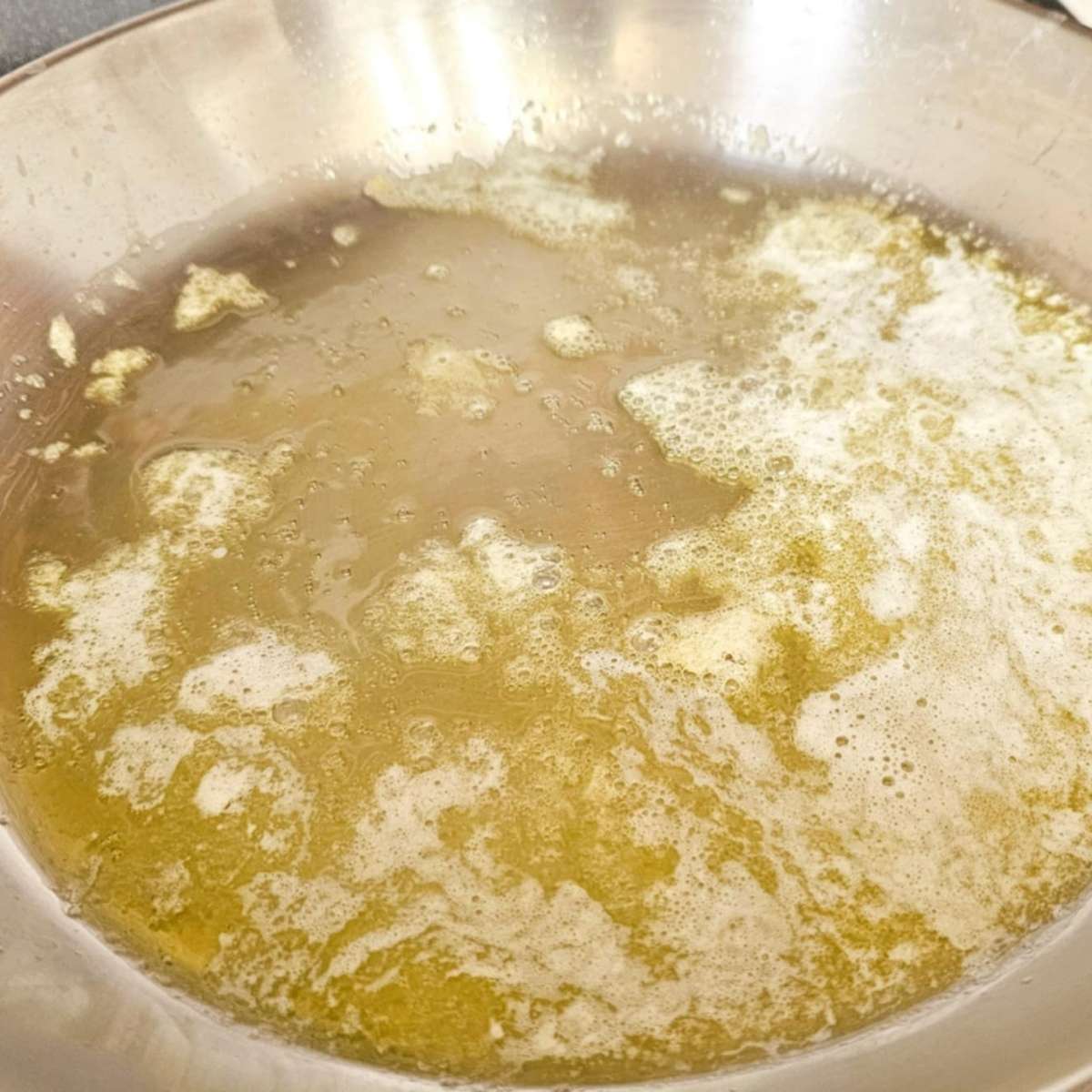 melted butter and olive oil in a stainless steel pan that has been melted on medium heat