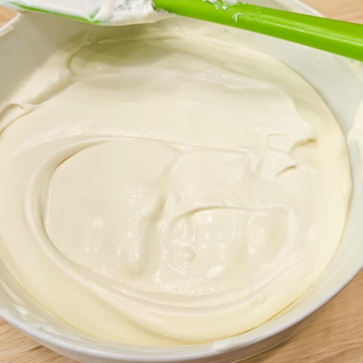 whip cream whipped in a bowl with sweetened condensed milk