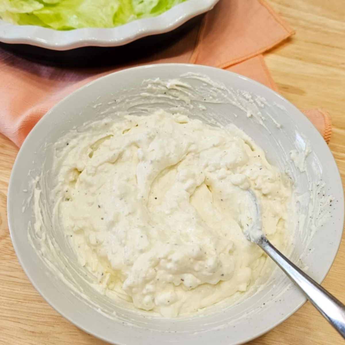 a small bowl with cream cheese blended with cottage cheese and salt and pepper