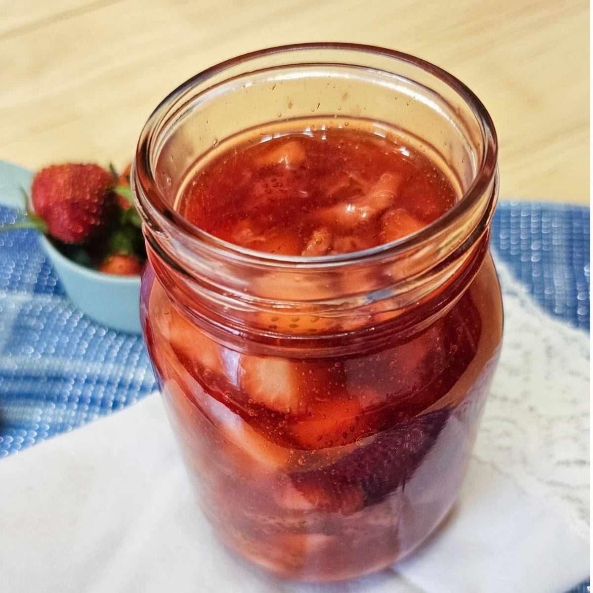 classic strawberry sauce in a mason jar cooling down before going into the fridge