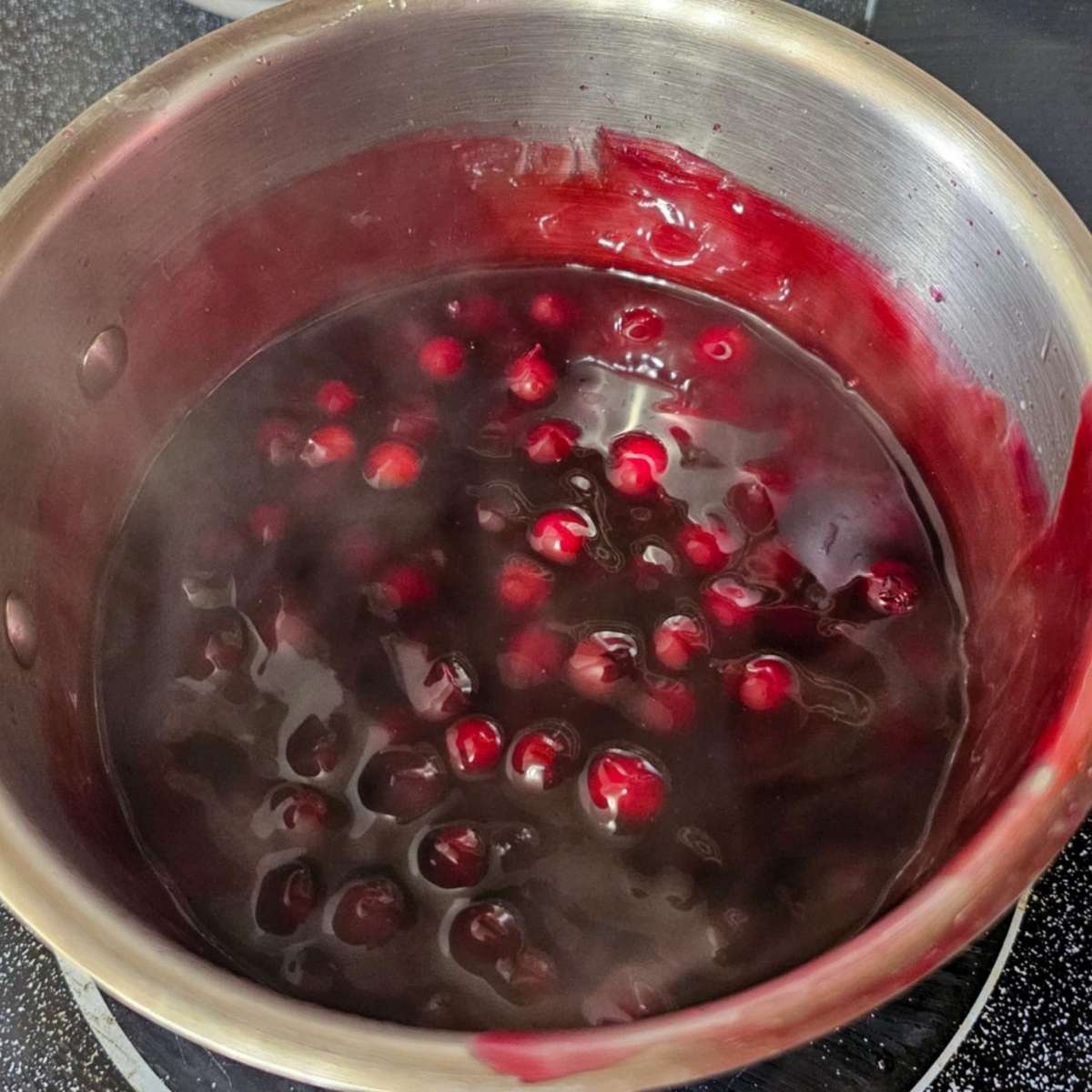 Saskatoon berry sauce in a pot that was thickened with cornstarch