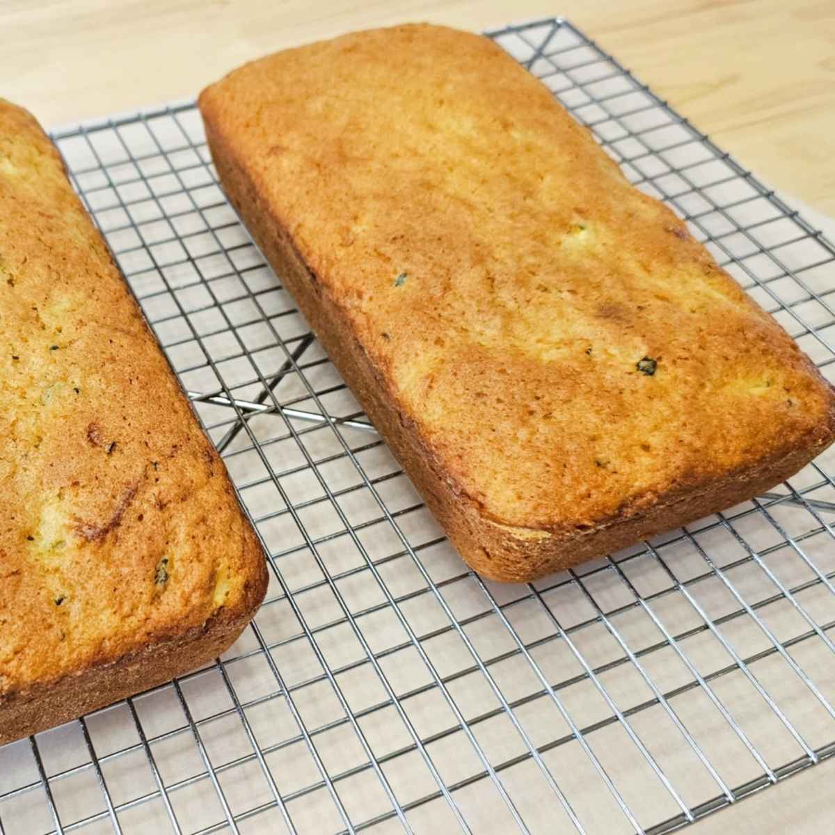 lemon zucchini bread on a wire rack cooling before adding the lemon glaze