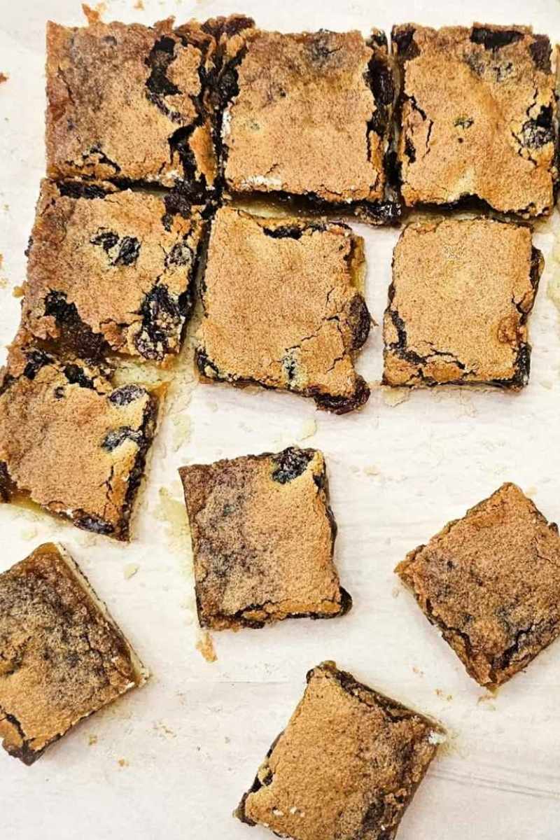sliced butter tart squares sitting on parchment paper