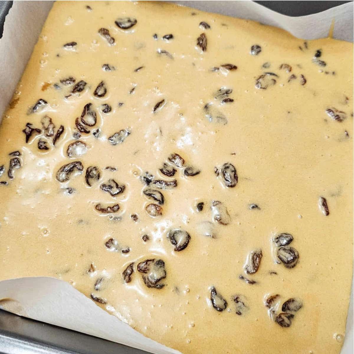 butter tart filling poured over the short bread crust