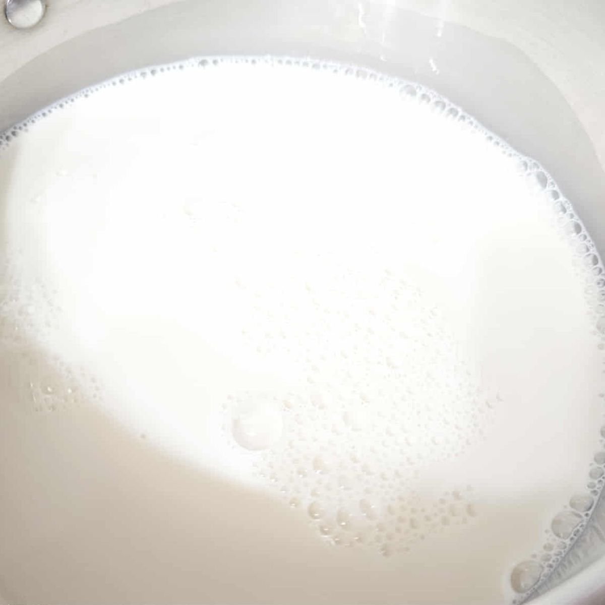 milk and pure maple syrup in a medium stainless steel pot
