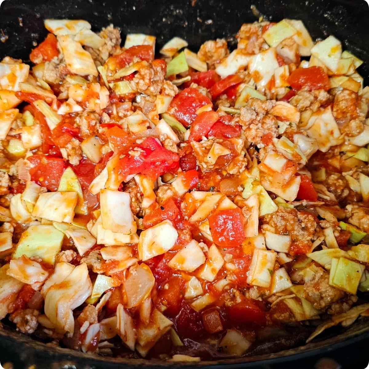 unstuffed cabbage rolls in a crock pot that was just mixed together
