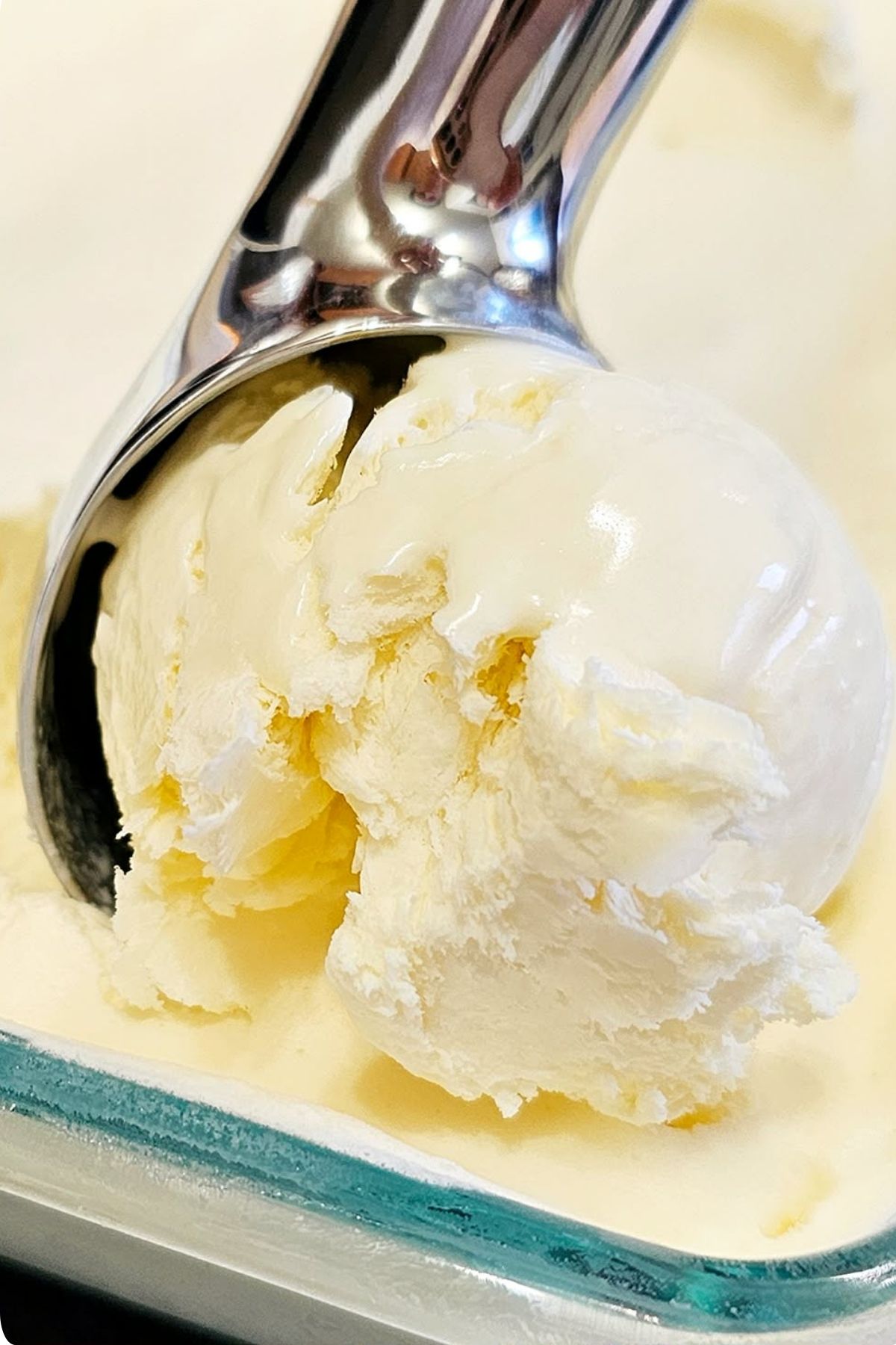no churn honey ice cream being scooped with an ice cream scoop, close up shot
