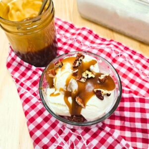 butterscotch sauce over vanilla ice cream and topped with diced pecans